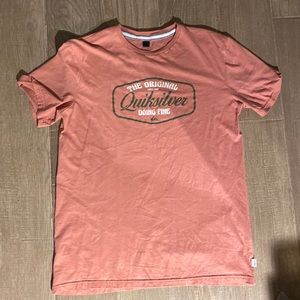 A large salmon coloured quicksilver tee